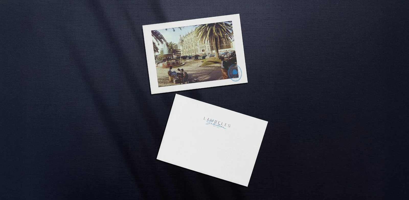 Postcard and envelope with a hotel's branding